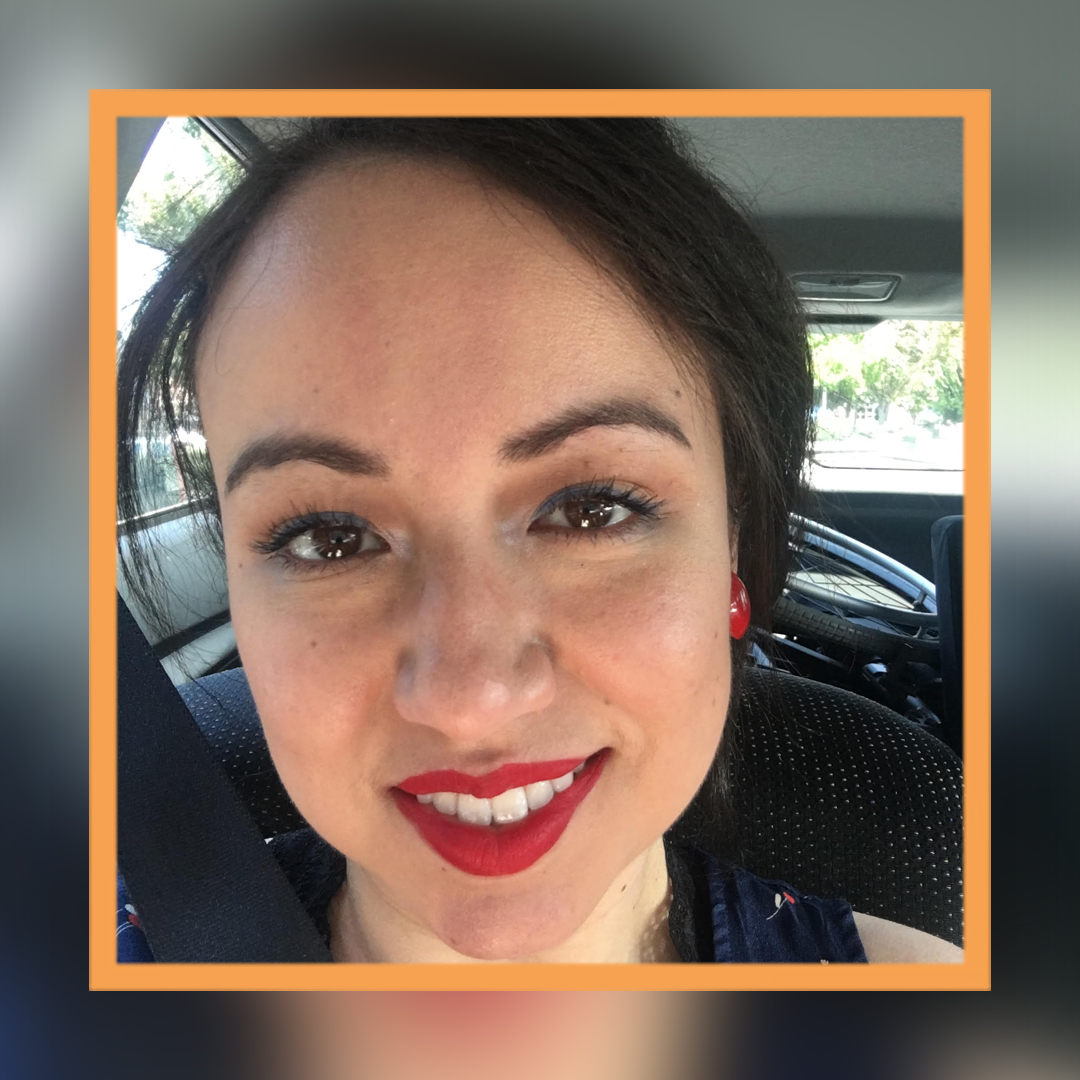 Felisha, wearing red lipstick with her hair tied back in a ponytail, is smiling at the camera. There is an orange square superimposed over the photo.