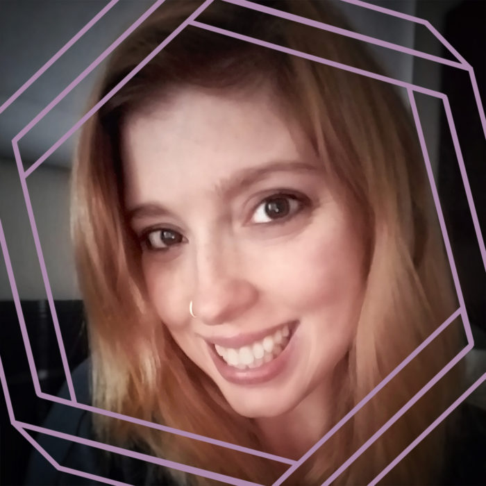 Elizabeth, a white woman with long blonde hair, smiles at the camera. There is a stylized purple hexagon framing the photo.