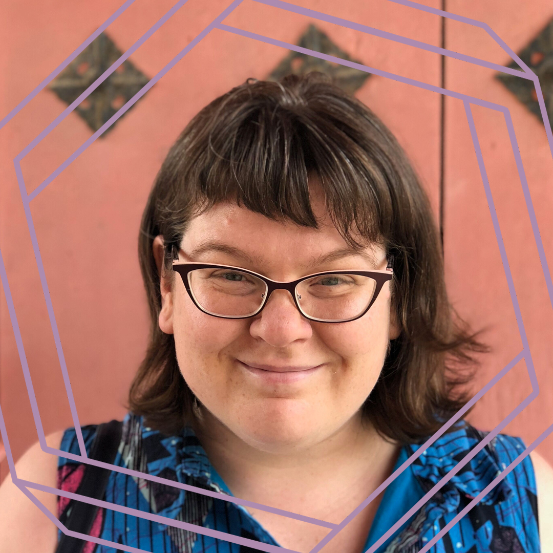 Meredith, a white woman with shoulder-length brown hair and black framed glasses, smiles at the camera. There is a stylized purple octagon superimposed over her face.