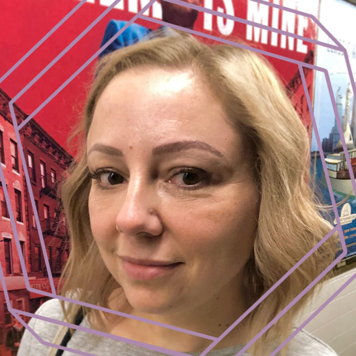 Becky, a white women with shoulder-length curled hair, smiles at the camera. There is a stylized purple hexagon framing the photo.